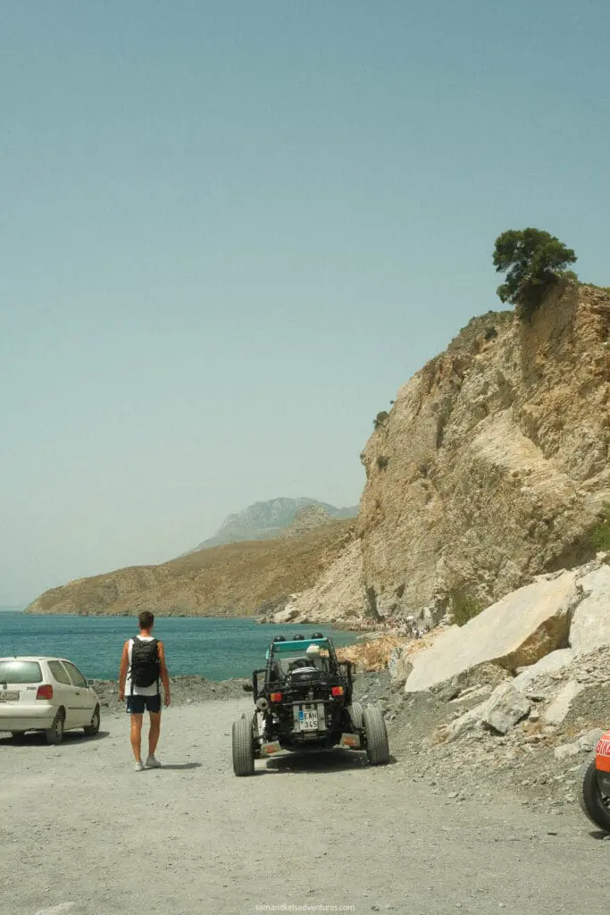 traveling to greece tips walking by the ocean with an atv and car