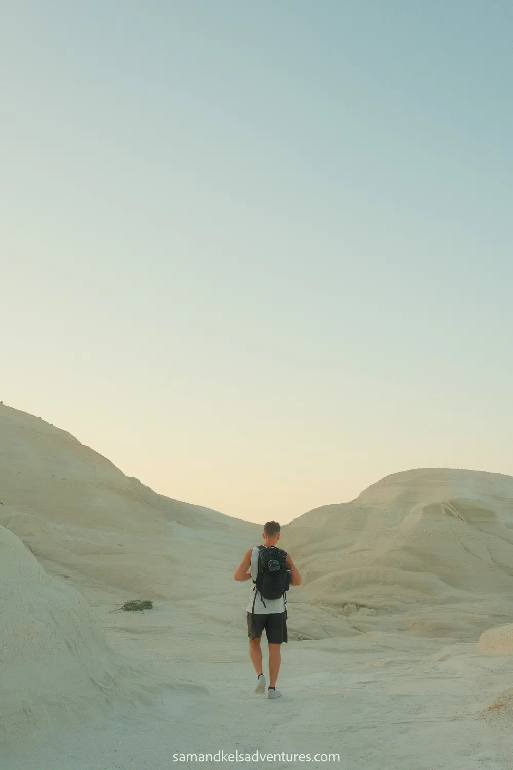 things to do in milos sam walking on white rocks 