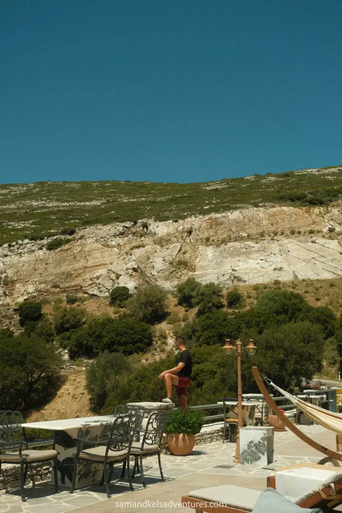 greece island hopping itinerary hotel and mountains in the background