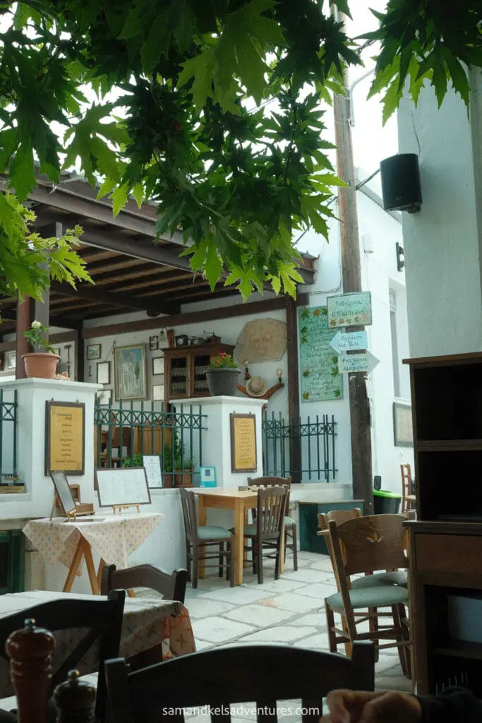 greece island hopping itinerary apeiranthos dinner tables on street