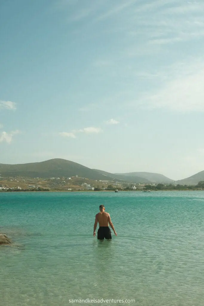 greece island hopping itinerary walking into water