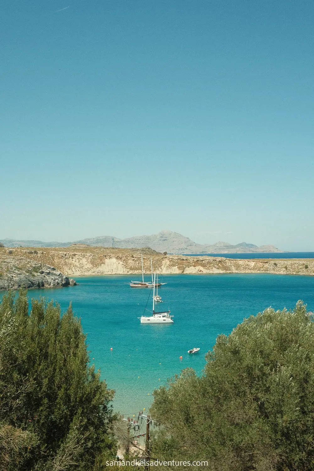 best beaches in rhodes anthony quinn with sailboat in the middle