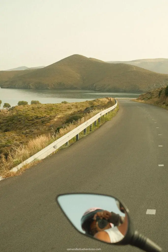 traveling to greece tips motorbike photo in mirrow while driving on a road