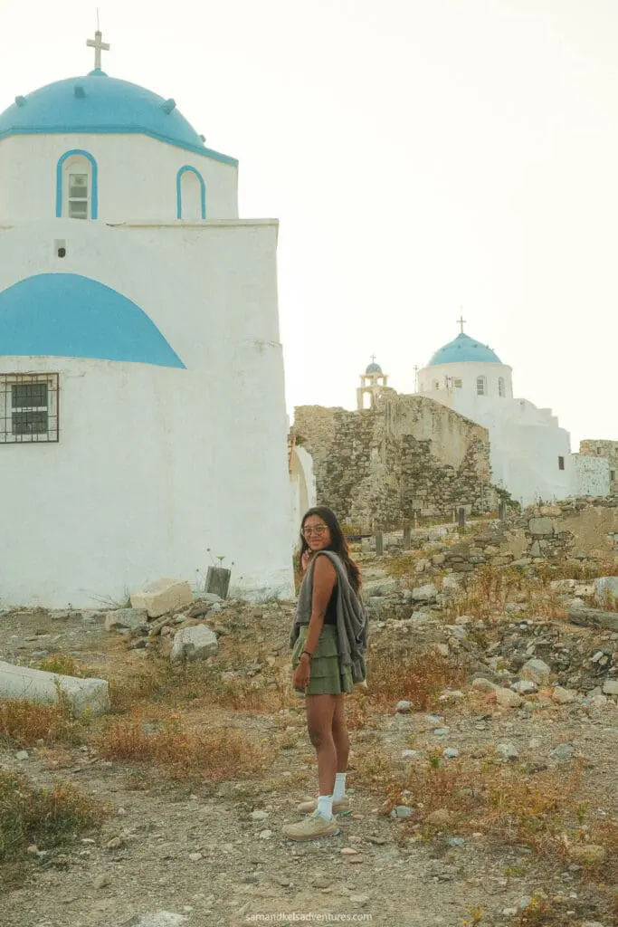 things to do in astypalaia walking near white church with blue domes