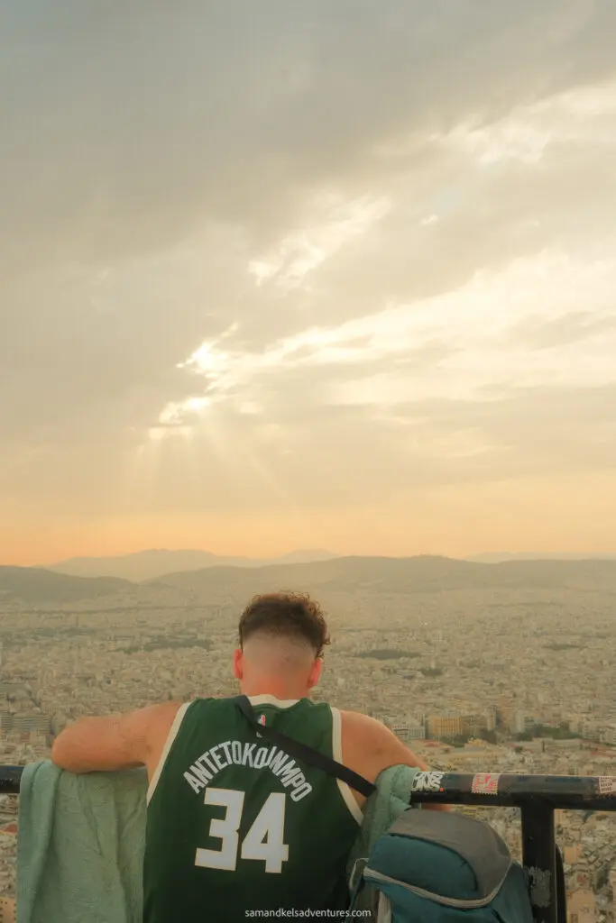 1 day in athens lycabettus hill sunset with guy wearing green giannis jersey