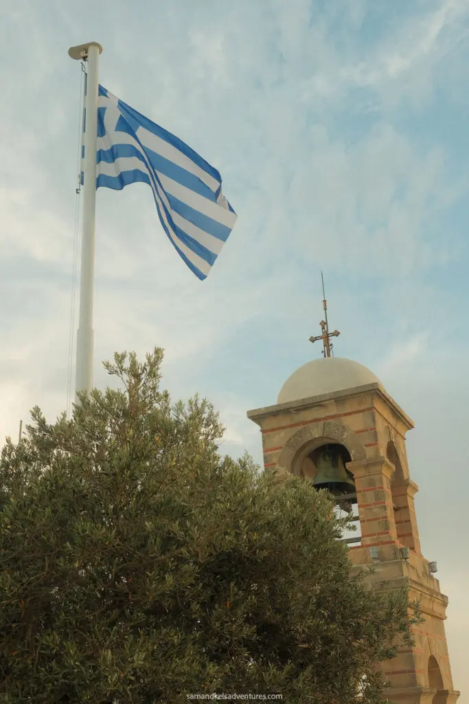 traveling to greece tips greek flag and bell tower