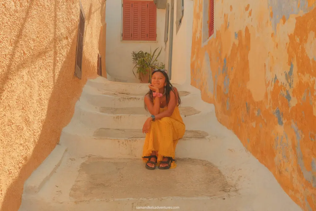 1 day in athens sitting on stairs orange buildings anafiotika