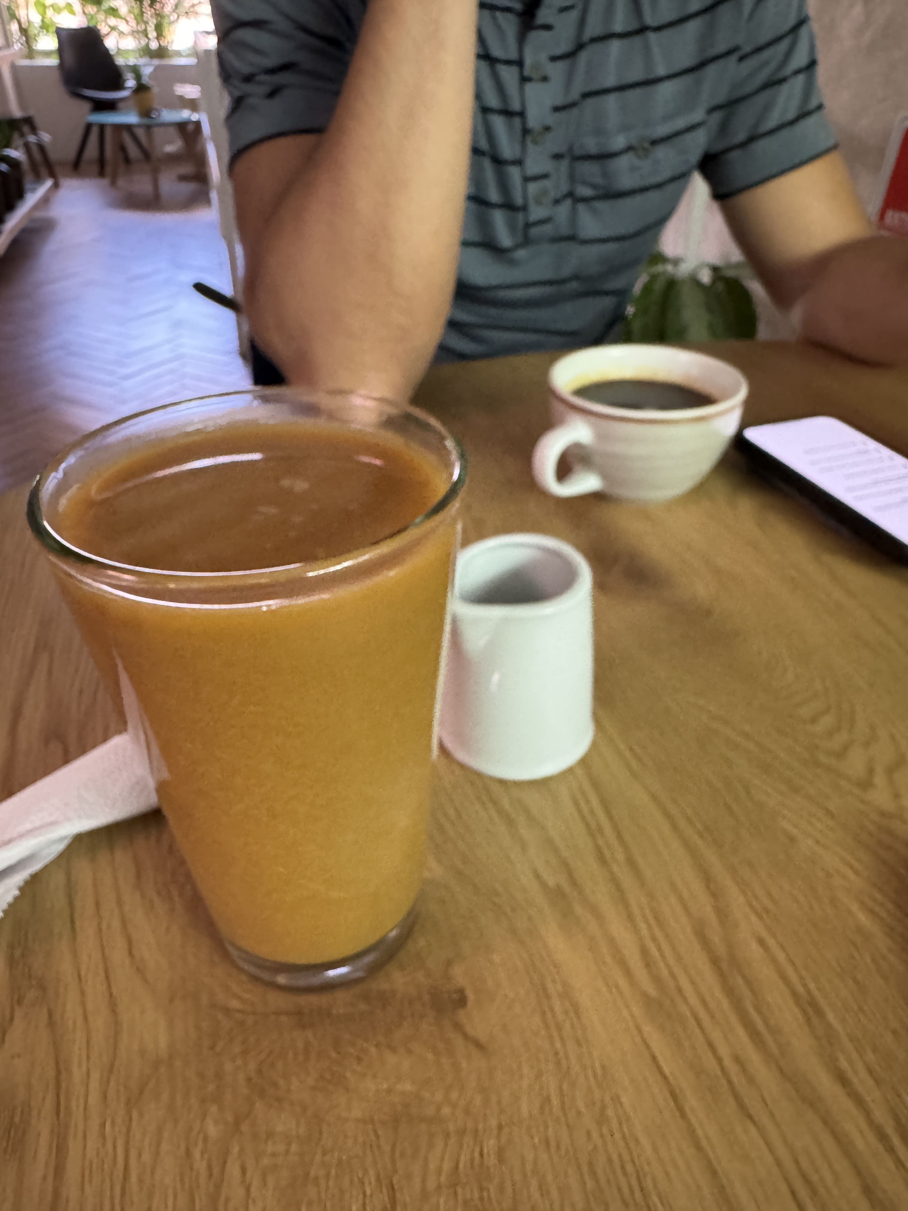 Iced Latte with almond milk and an americano on the table at a cafe in Laureles 